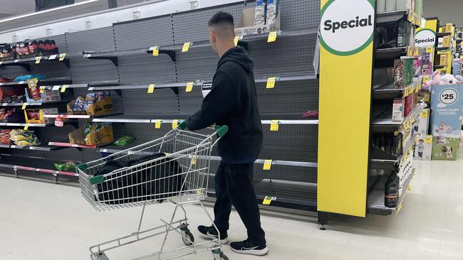 Woolworths shelves are empty as workers continue a picket line at distribution centres. Picture: NewsWire