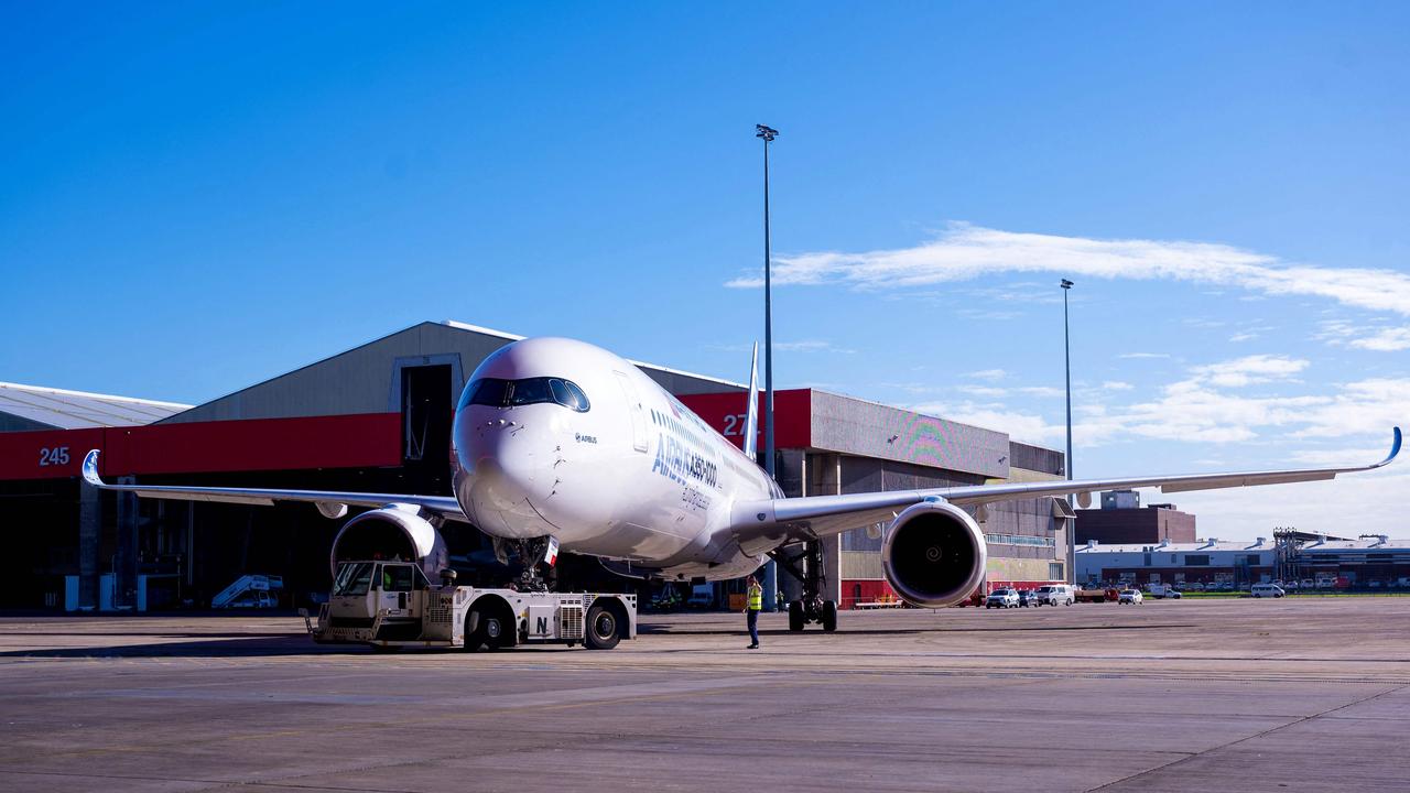 An Airbus A350-1000 aircraft is parked on the tarmac at Sydney international airport to mark a major fleet announcement by Australian airline Qantas. Picture: Wendell TEODORO / AFP.