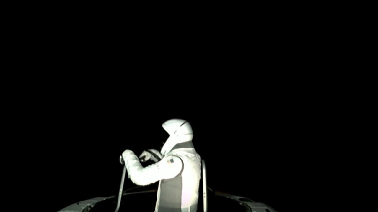 He steps out into the dark vacuum of space. Picture: SpaceX