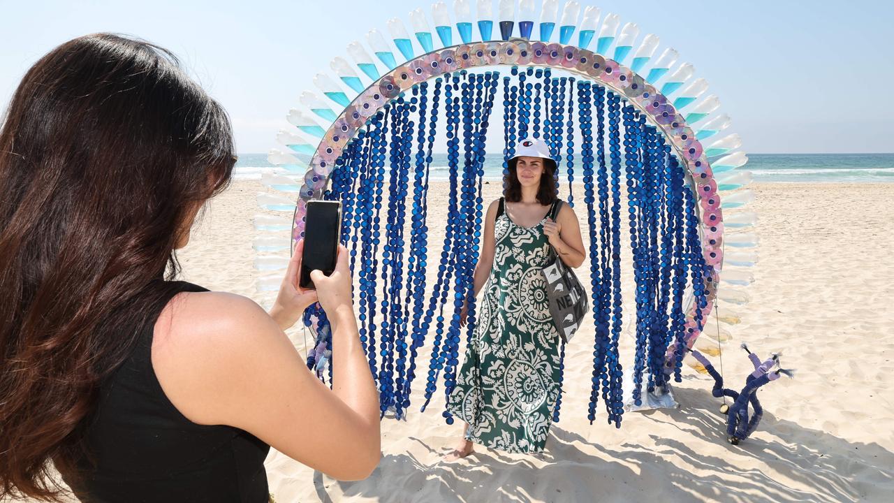 Swell Festival at Currumbin. Paloma Fe Baquero (Surfers Paradise) has photo taken in front of Horizon Gate by Amelia Bachelor.Picture Glenn Hampson