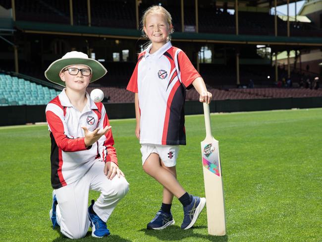 Sam Kelliher and Susie Deeming of Leichhardt Wanderers Junior Cricket team pose for photos at Sydney Cricket Ground. Picture: Ted Lamb