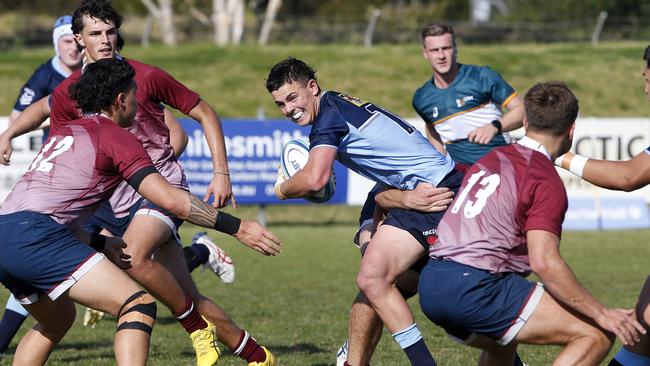 Waratahs' Joe Walsh with the ball in the main event on Tuesday. Picture: John Appleyard