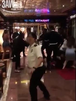 A group of men can be seen fighting in the footage captured on board the Carnival Legend. Picture: 3AW
