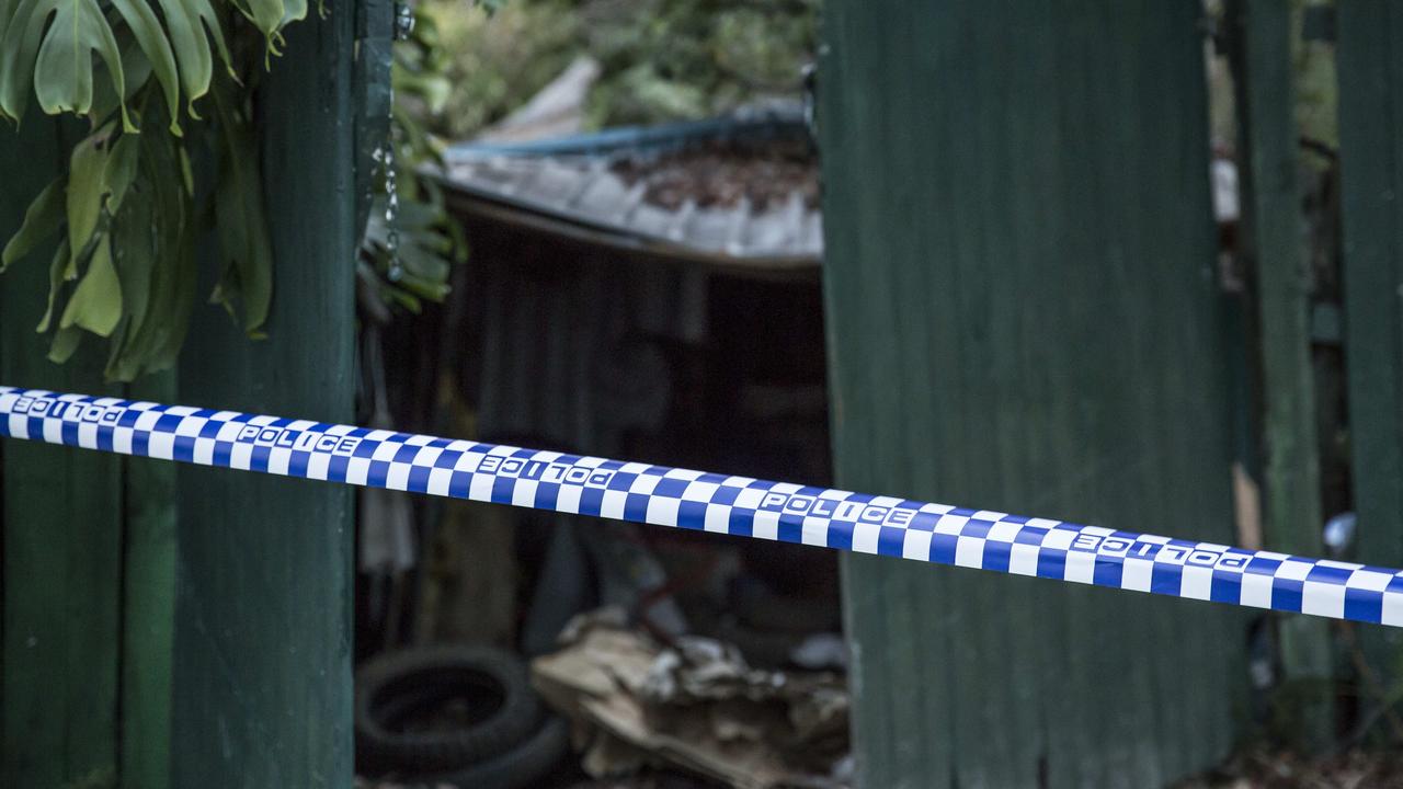 Behind the police tape lay a house stuffed with garbage and the two decomposing bodies of Shane Snellman and Bruce Roberts. Picture: Damian Shaw
