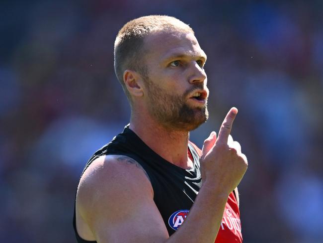 MELBOURNE, AUSTRALIA - MARCH 16: Jake Stringer of the Bombers celebrates kicking a goal during the round one AFL match between Essendon Bombers and Hawthorn Hawks at Melbourne Cricket Ground, on March 16, 2024, in Melbourne, Australia. (Photo by Quinn Rooney/Getty Images)