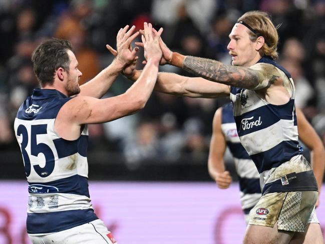 GEELONG, AUSTRALIA - JULY 20: Tom Stewart of the Cats celebrates kicking a goal  during the round 19 AFL match between Geelong Cats and Western Bulldogs at GMHBA Stadium, on July 20, 2024, in Geelong, Australia. (Photo by Daniel Pockett/Getty Images)