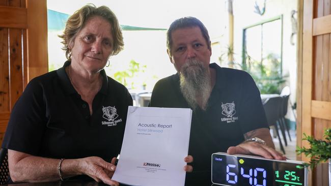 Silkwood Hotel owners Cassie and Paul Grover review an acoustic report they will be submitting to the Office of Liquor and Gaming Regulation in order to host live music exceeding 75 decibels. Picture: Arun Singh Mann