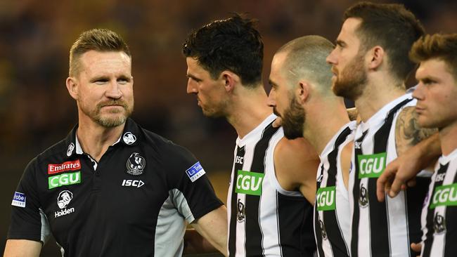 Magpies coach Nathan Buckley with his players after the national anthem before the preliminary final against Richmond. Picture: AAP Image/Julian Smith