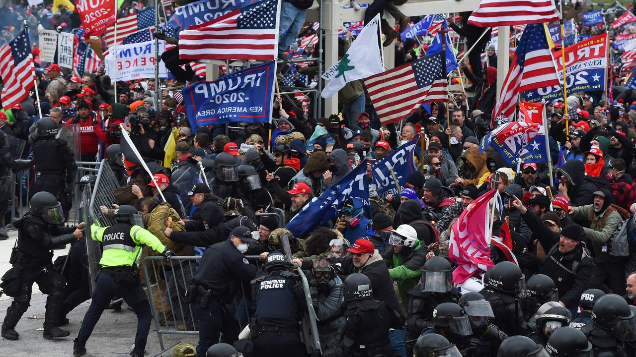 Mr Trump’s supporters fighting with overwhelmed police outside the US Capitol. Picture: Roberto Schmidt/AFP