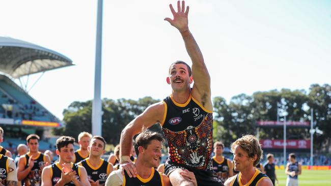 Taylor Walker celebrates his 200th game in 2020. Picture: Matt Turner/AFL Photos via Getty Images