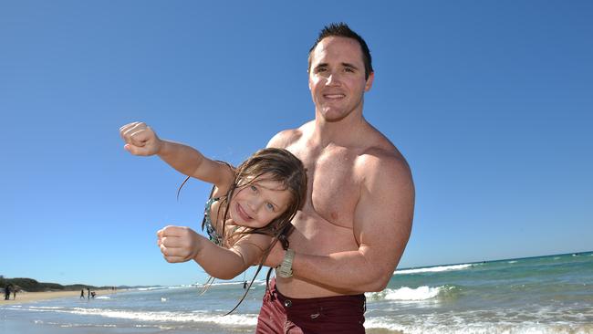 Six-year-old, Isabella and her dad Wayde High enjoying the weather on Coolum Beach in 2013.