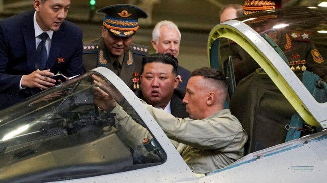 Kim Jong-un peers into the cockpit of Russia’s most advanced fighter at Komsomolsk-on-Amur on Friday. Picture: Reuters