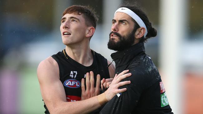 It will be some time before Mark Keane can do competitive work with Brodie Grundy again after injuring his finger. Picture: Michael Klein