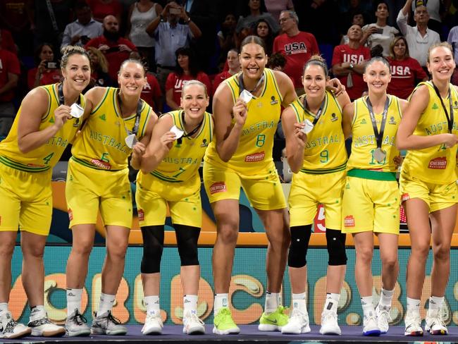 Australia players celebrate on the podium with their silver medals after the FIBA 2018 Women's Basketball World Cup final match between Australia and United States at the Santiago Martin arena in San Cristobal de la Laguna on the Canary island of Tenerife on September 30, 2018. (Photo by JAVIER SORIANO / AFP)