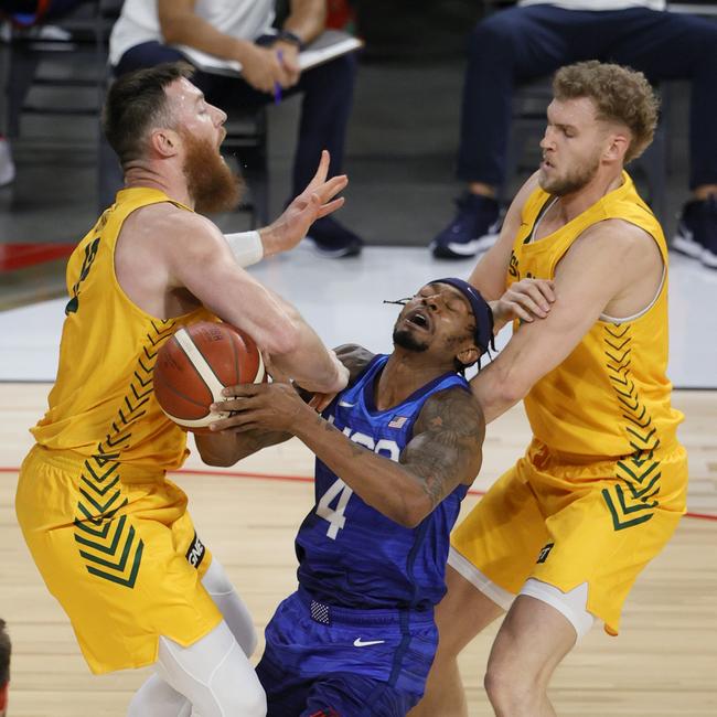 (L-R) Aron Baynes, Bradley Beal and Jock Landale come together during an exhibition game at Michelob Ultra Arena ahead of the Tokyo Olympic Games on July 12. Picture: Ethan Miller/Getty Images/AFP