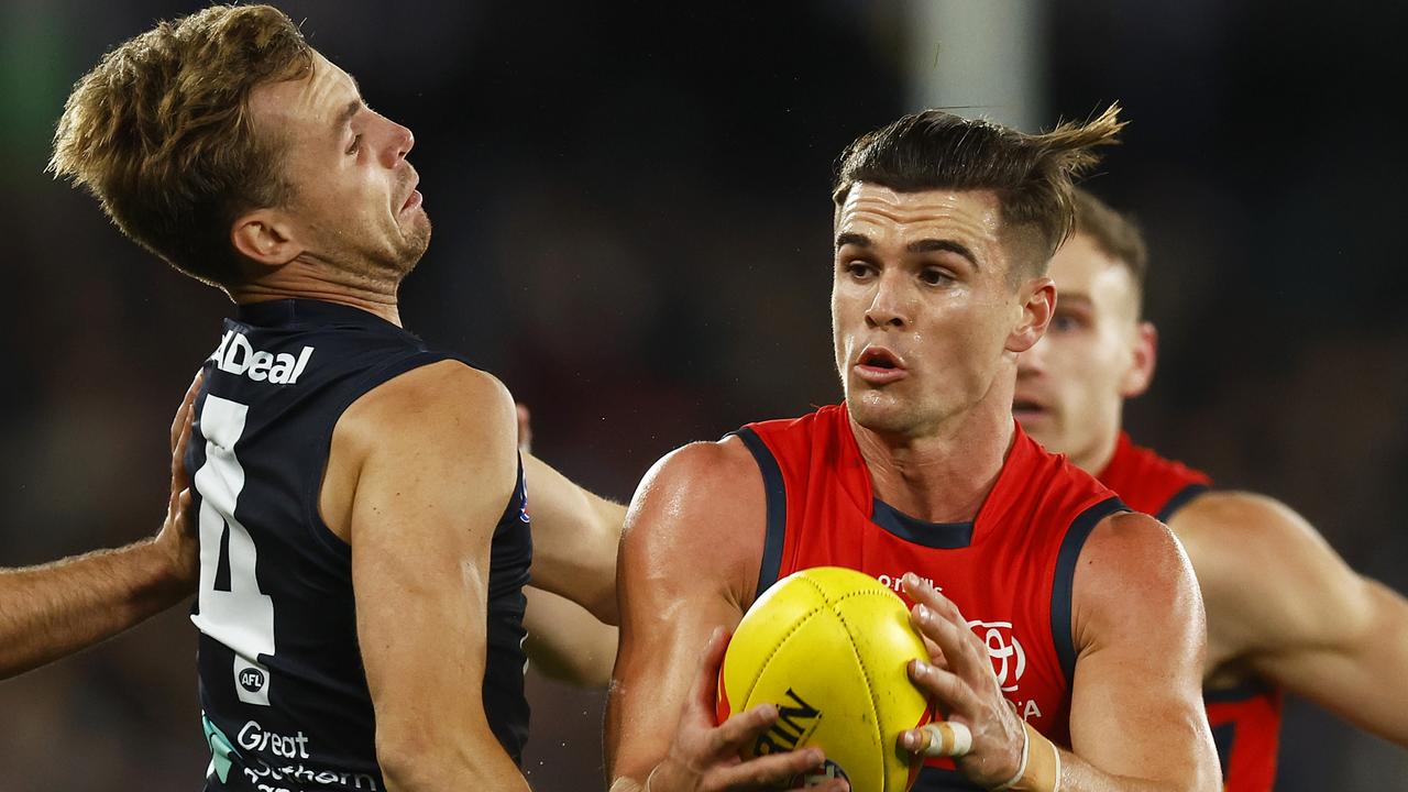 Ben Keays runs with the ball under pressure from Lochie O'Brien. Picture: Daniel Pockett/Getty Images