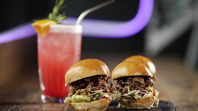 Pulled pork sliders with the Bushwhacked cocktail. Picture: Adam Yip