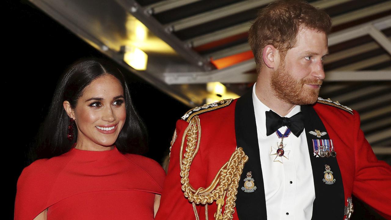 Britain's Prince Harry and Meghan, Duchess of Sussex held hands as they arrived at the Royal Albert Hall in London. Picture: Simon Dawson/Pool via AP.