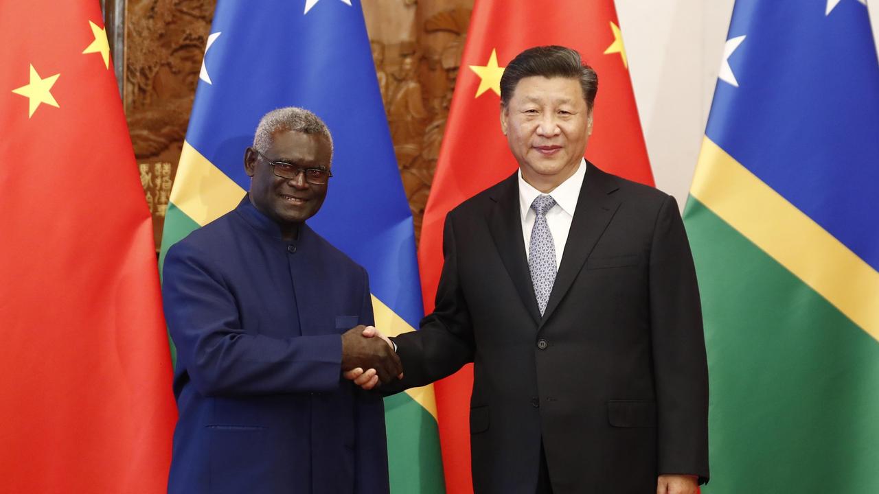 Chinese President Xi Jinping (R) shakes hands with Prime Minister Manasseh Damukana Sogavare of the Solomon Islands. Picture: Getty Images