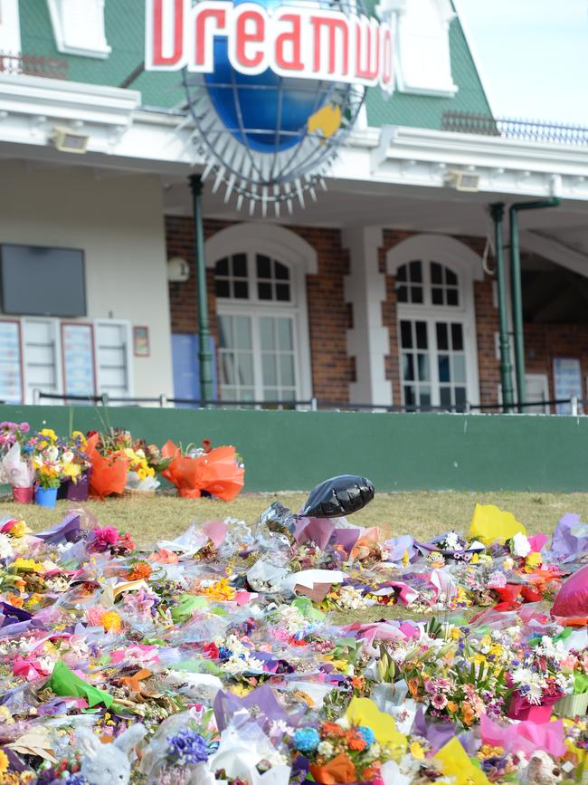 Flowers left on the front lawn at Dreamworld after the tragedy where four people lost their lives.