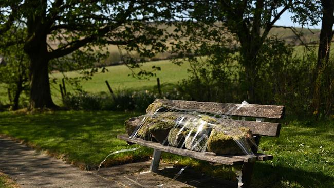 A bench is taped up in the hamlet of Diglea, northern England on April 17.