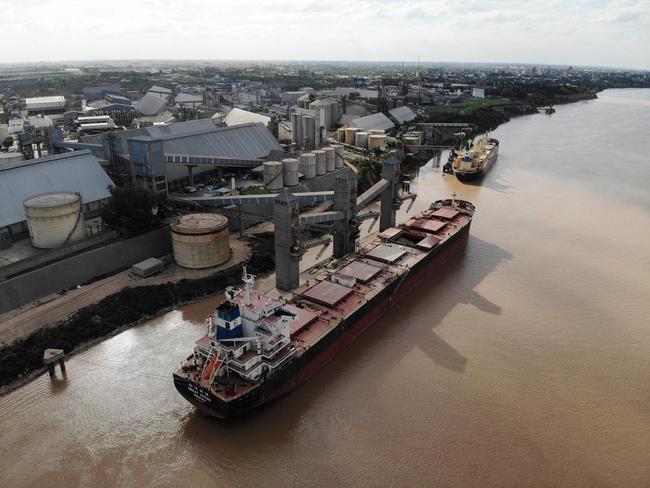 View of a ship having grain loaded in San Lorenzo, 30 km north of Rosario, Santa Fe province, Argentina, on March 14, 2022, - Argentina's government announced on Monday it had suspended exports of soyabean flour and oil amidst rumors it is planning to hike taxes due to soaring primary material costs blamed on Russia's invasion of Ukraine. (Photo by AFP)