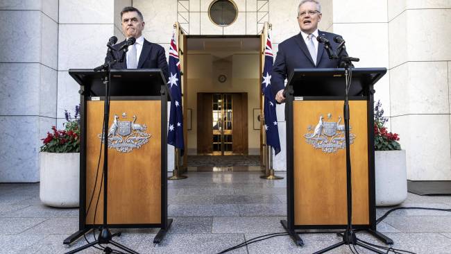 With a good distance between them, Prime Minister Scott Morrison with the Chief Medical Officer Brendon Murphy during a press conference at Parliament House in Canberra. Picture Gary Ramage