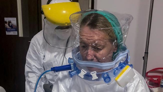 Journalist Amanda Hodge is prepared by hospital staff at Siolam Hospital in Jakarta for an air ambulance flight to Australia, June 22. Picture: Graham Crouch