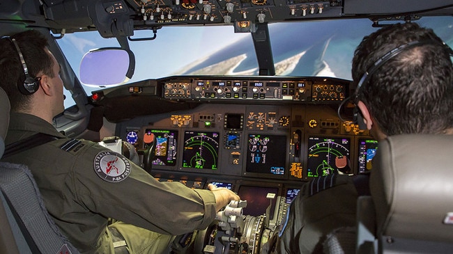 Aircrew utilise the Operational Flight Trainer inside the new training facilities at RAAF Base Edinburgh.