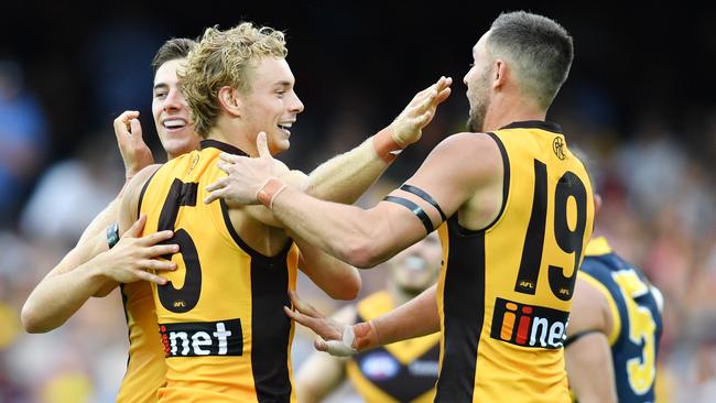 James Worpel celebrates a goal with Jack Gunston of the Hawks during the Round 1 win over the Adelaide Crows. Picture: AAP Image/David Mariuz