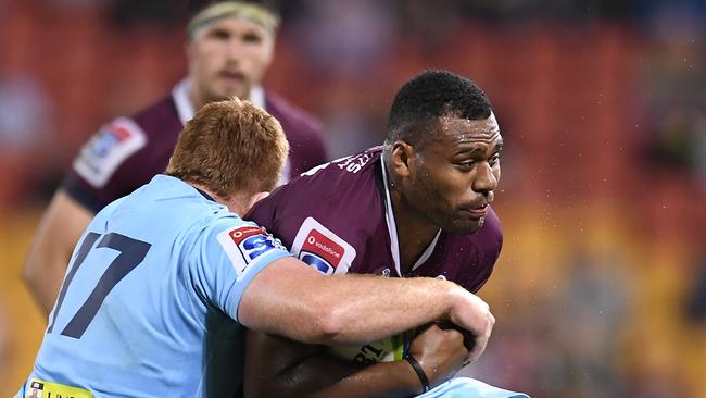 BRISBANE, AUSTRALIA - MAY 18: Samu Kerevi of the Reds is tackled during the round 14 Super Rugby match between the Reds and the Waratahs at Suncorp Stadium on May 18, 2019 in Brisbane, Australia. (Photo by Albert Perez/Getty Images)