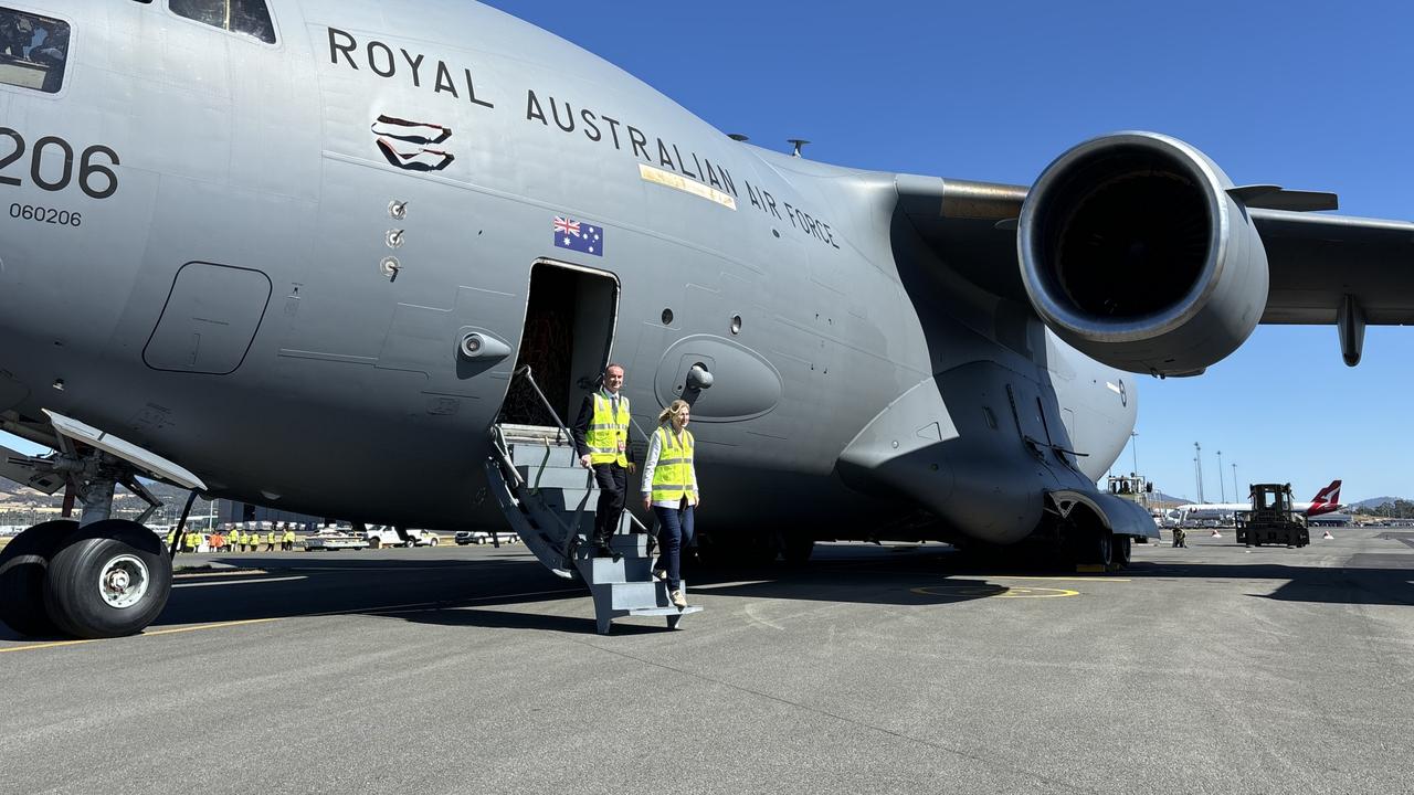 Federal Member for Franklin Julie Collins and Hobart Airport CEO Norris Carter stepping off a Royal Australian Air Force Boeing C-17A Globemaster III. Picture: Simon McGuire.