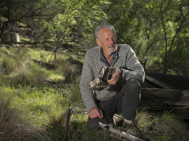 November 2019: Nick Mooney, wildlife expert, checks camera traps used for wildlife monitoring. Central Highlands Tasmania.