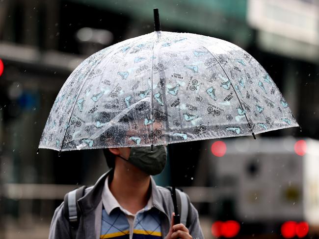 ADELAIDE, AUSTRALIA - NewsWire Photos September 14 2022: Adelaide pedestrians try to keep dry as Adelaide is hit with rain. Picture: NCA NewsWire / Kelly Barnes