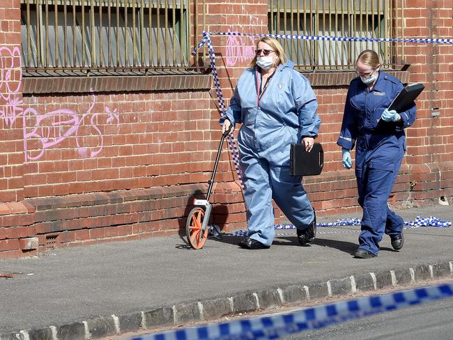 Police investigators on Lygon St after Joe Acquaro’s body was found. Picture: Nicole Garmston