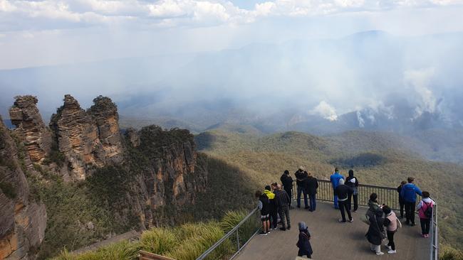 The Blue Mountains’ iconic tourist attraction, Scenic World, is under the protection of firefighters as strong winds continue to burn south towards the Katoomba and Leura areas. View from Echo Point. Picture: Isabell Petrinic