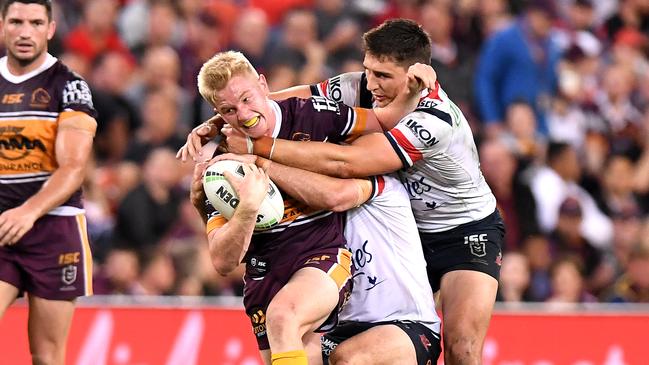 Tom Dearden looks to burst through a tackle. Picture: Bradley Kanaris/Getty Images