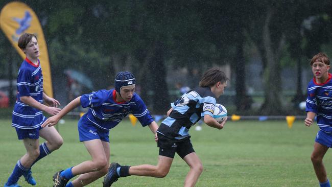 Day 1 of the King of the Country junior rugby union tournament at the Gold Coast Eagles Rugby Union Club.Maroochydore Swans (BLUE AND BLACK) vs USQ Saints (Blue ) Maroochydore Player No USQ Player No Pic Mike Batterham