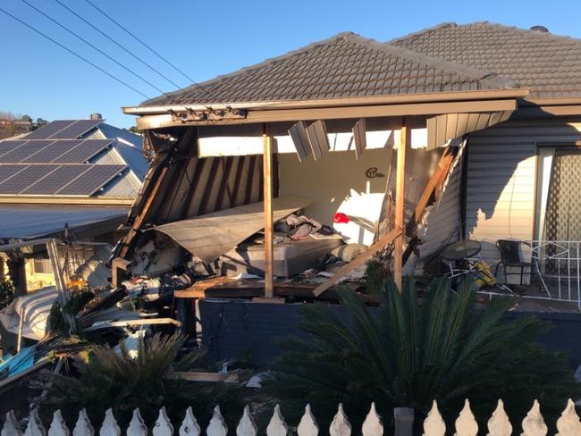 A man will face court next month after a car hit a house at Cringila, narrowly missing the sleeping family of three. Picture: GoFundMe