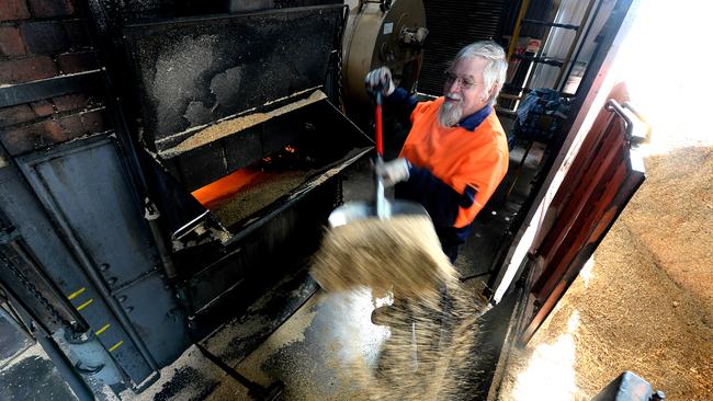 Steve Pool stokes a century-old boiler at the Golden North Ice Cream factory at Laura. The plant is full of modern equipment and has been significantly updated in recent years, but this old tech still works perfectly well. Picture: BERNARD HUMPHREYS