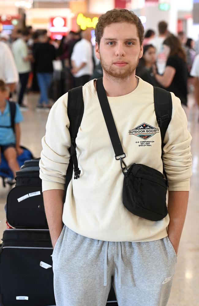 Idan at Sydney International airport on Friday, just returned from Israel after fleeing the conflict. Picture: Jeremy Piper