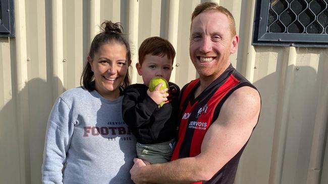 Burkett with son Elijah and wife Siew-Yee. Picture: Ty Burkett