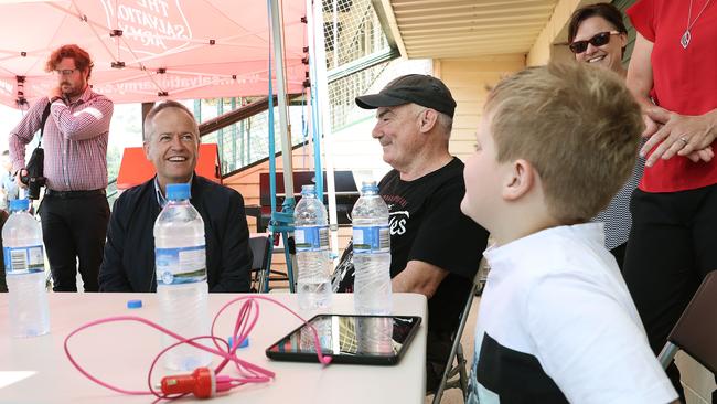 Federal Labor Leader Bill Shorten, left, meets Huon Valley residents Fredrick Leech (centre) and Lachie Berry on his visit to Huonville to visit the fire-affected community. Picture: LUKE BOWDEN