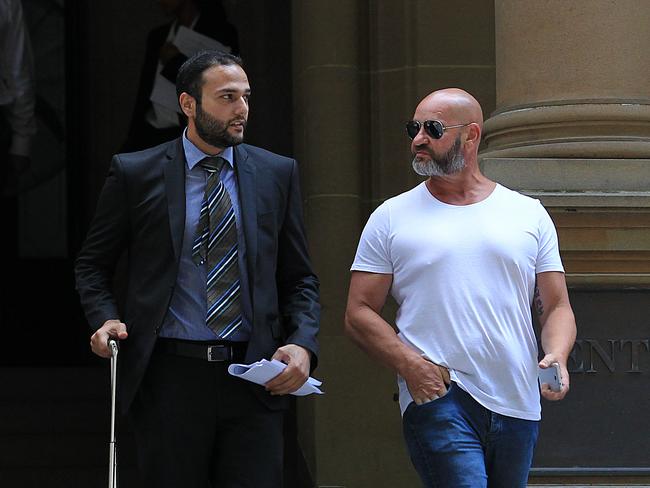 Lawyer Abbas Soukie and a supporter leave Central Local Court after a magistrate made orders to have his client Jabour Lahood extradited to WA.