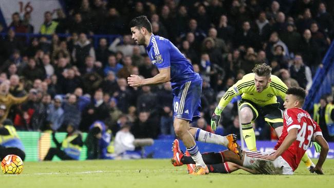 Chelsea's Diego Costa gets round Manchester United's goalkeeper David de Gea to score.