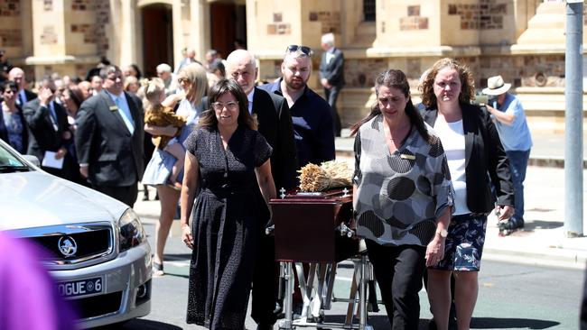 The family of Archbishop Wilson escort the coffin to the hearse during the funeral. Picture: NCA NewsWire / Kelly Barnes