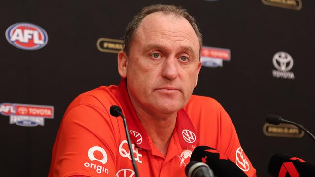 MELBOURNE, AUSTRALIA - SEPTEMBER 28: John Longmire, Senior Coach of the Swans speaks to the media after the AFL Grand Final match between Sydney Swans and Brisbane Lions at Melbourne Cricket Ground, on September 28, 2024, in Melbourne, Australia. (Photo by Robert Cianflone/AFL Photos via Getty Images)