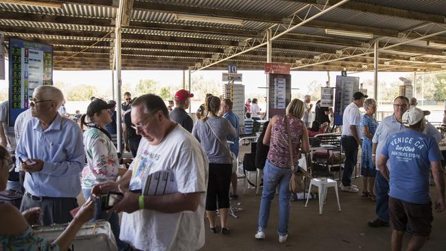 Punters place a bet at the Coonamble races. Picture: Dylan Robinson