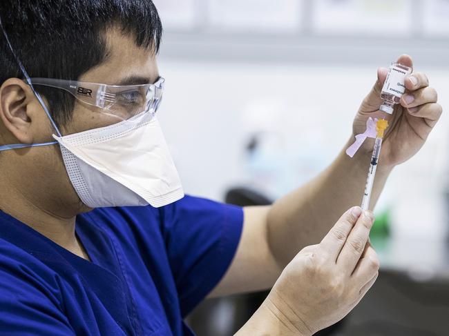 A healthworker prepares a dose of AstraZeneca vaccine in Melbourne. Picture: Getty Images