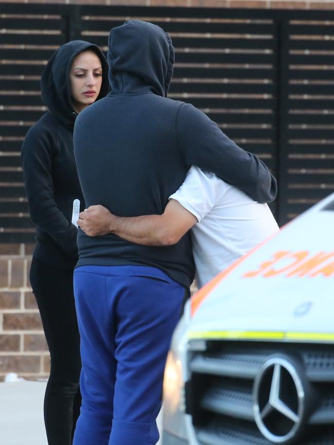 Family member consoled by friend. Picture: John Grainger